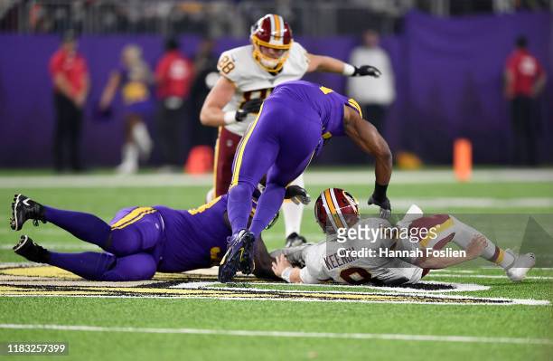 Quarterback Case Keenum of the Washington Redskins fumbles the ball and is recovered by Shamar Stephen of the Minnesota Vikings during the game at...