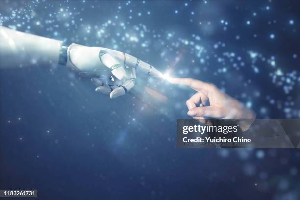 robot finger touching to human finger with emotional scene - roboter hand stock-fotos und bilder