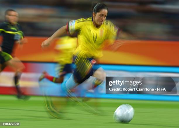 Diana Ospina of Colombia runs with the ball during the FIFA Women's World Cup 2011 Group C match between Korea DPR and Colombia at the FIFA Womens...