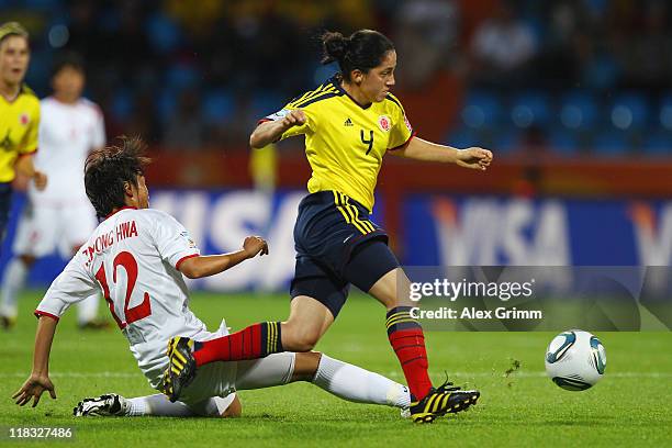 Diana Ospina of Colombia eludes Jon Myong Hwa of Korea DPR during the FIFA Women's World Cup 2011 Group C match between Korea DPR and Colombia at the...