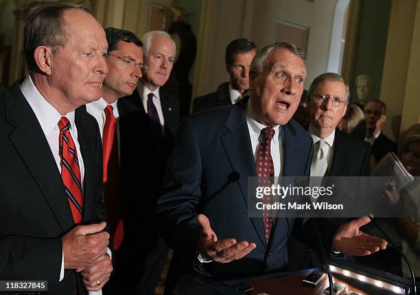 Senator Jon Kyl , speaks about budgets talks with Democrats, while flanked by Senate Minority Leader Mitch McConnell , Sen. Lamar Alexander , Sen....