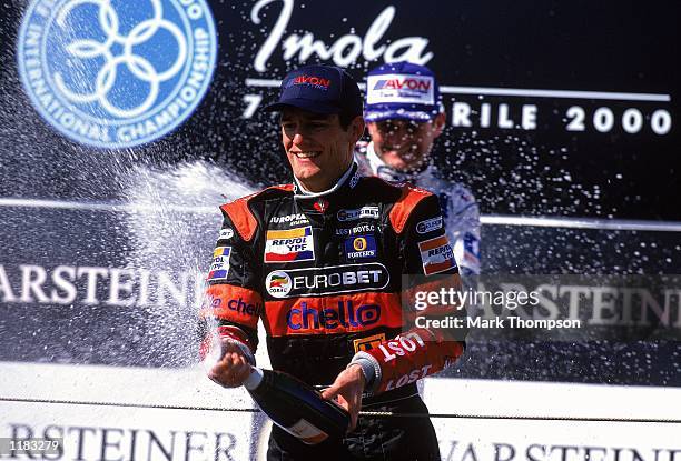 European Arrows team driver Marc Webber celebrates third place in the FIA Formula 3000 race at Imola in San Marino. \ Mandatory Credit: Mark Thompson...