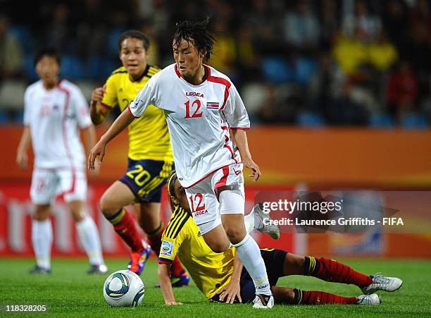 Daniela Montoya of Colombia battles with Jon Myong Hwa of Korea DPR during the FIFA Women's World Cup 2011 match between Korea DPR and Colombia at...