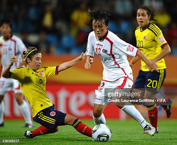 Daniela Montoya of Colombia battles with Jon Myong Hwa of Korea DPR during the FIFA Women's World Cup 2011 match between Korea DPR and Colombia at...