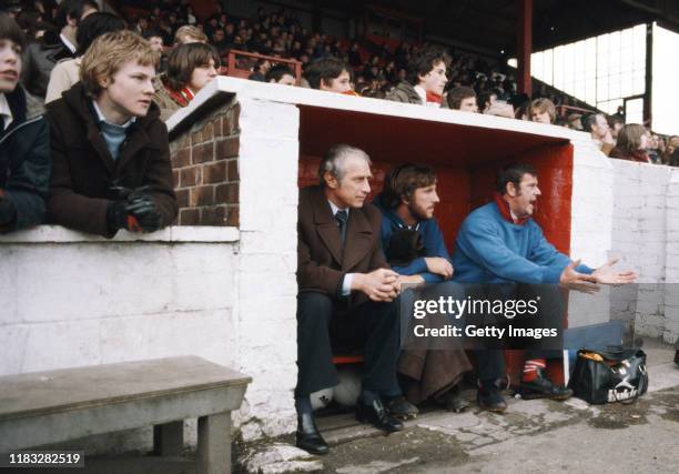 England cricket captain Ian Botham of Scunthorpe United looks on as a substitute with manager Ron Ashman during the League Division Four match...