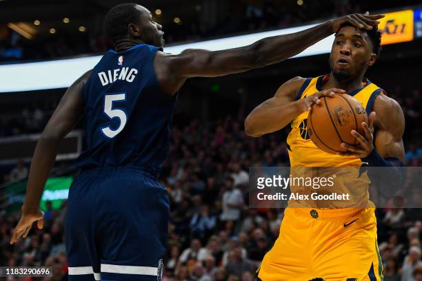 Donovan Mitchell of the Utah Jazz attempts a pass around Gorgui Dieng of the Minnesota Timberwolves during a game at Vivint Smart Home Arena on...