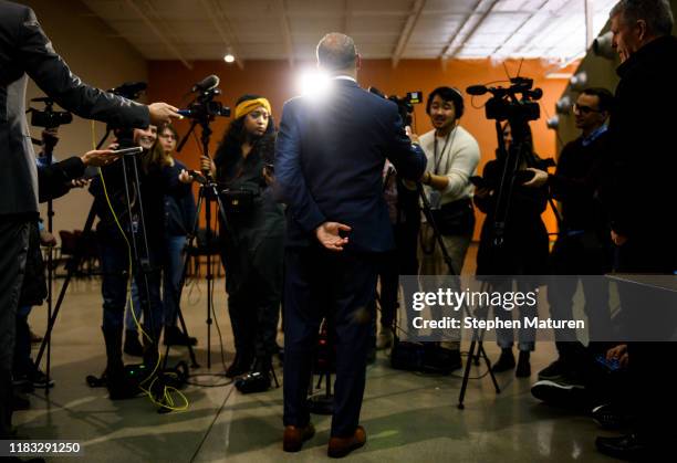 Former Massachusetts Governor Deval Patrick speaks with members of the media after attending a meeting of the Polk County Democrats on November 18,...