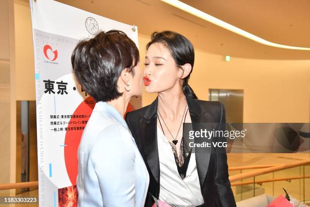 Actress Dai Lele and actress Qu Jingjing kiss during an opening event of 2019 China Film Week in Tokyo on October 24, 2019 in Tokyo, Japan.