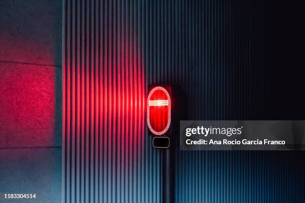 a red traffic light in a subway station. semaphore - red lights stock pictures, royalty-free photos & images