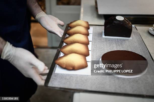 This illustration picture taken on November 15, 2019 shows madeleines, or shell-shaped cookies, prepared by the pastry chef of the Ritz hotel,...