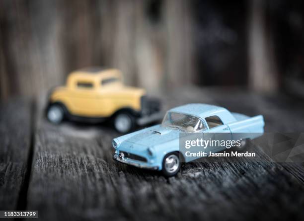 toy vintage car on wooden background - archival car stock pictures, royalty-free photos & images
