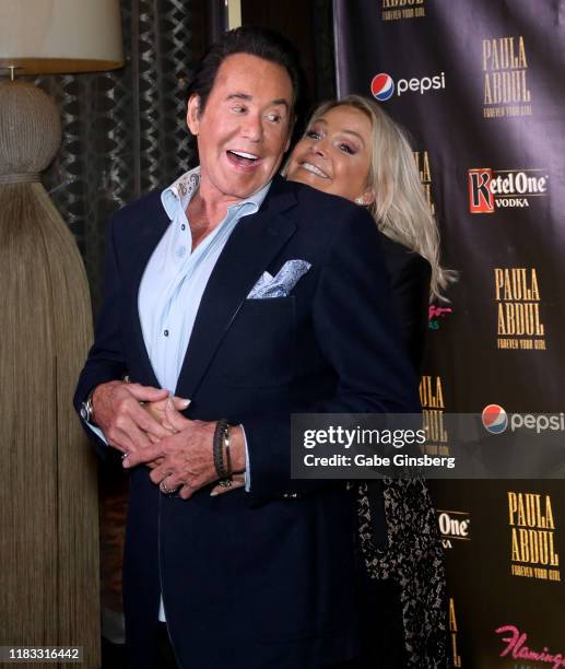 Entertainer Wayne Newton is photobombed by his wife Kathleen McCrone during the official opening for the "Paula Abdul: Forever Your Girl" Flamingo...