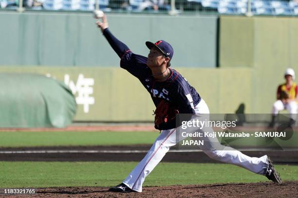 Yoshinobu Yamamoto of Samurai Japan throws a pitch in the bottom half of the sixth inning during the practice game between Samurai Japan and Hokkaido...