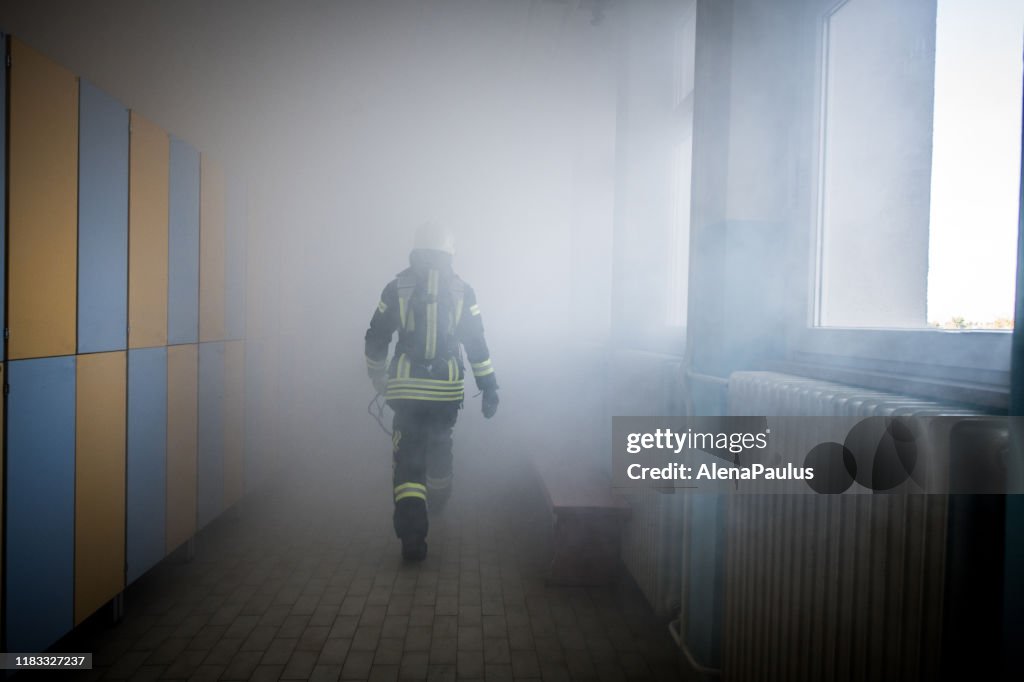 Firefighter in fire-rescue operation