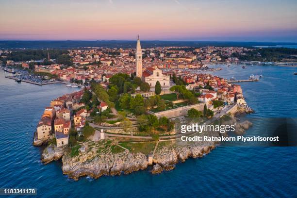 aerial drone view of rovinj old city and st. euphemia's church, rovinj, croatia - rovinj stock pictures, royalty-free photos & images