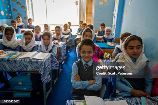 Afghan boys and girls attend mixed classes at the Ariana Kabul Private School on September 17 in north Kabul, Afghanistan. The school represents one...