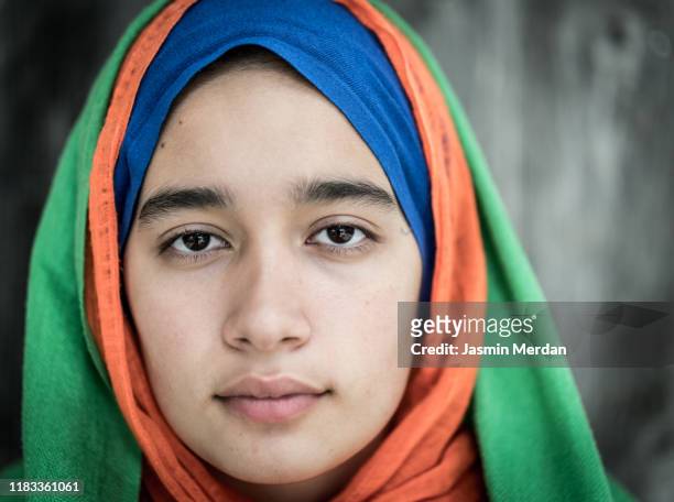 muslim girl with colourful scarf - afghan girl stock pictures, royalty-free photos & images