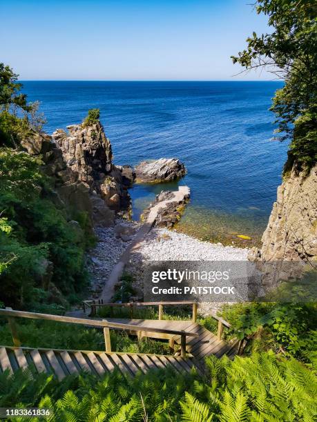 liebertsklippen berth below the bornholm art museum in helligdomsklipperne (sanctuary cliffs), bornholm island, denmark. - bornholm island stock pictures, royalty-free photos & images