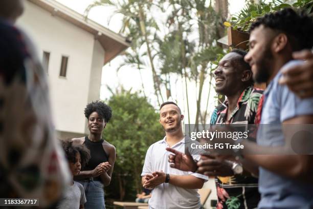 family reunited, singing in backyard - parents applauding stock pictures, royalty-free photos & images