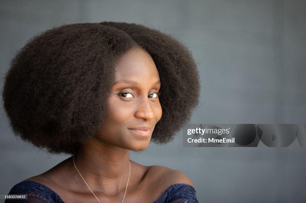 Portrait Of A Cheerful Africanamerican Woman With An Afro Profile High ...