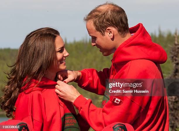 Prince William, Duke of Cambridge and Catherine, Duchess of Cambridge try on red jackets as they visit the Canadian Rangers station on July 5, 2011...