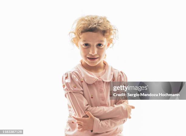 one young jewish girl looking innocently at the camera on a white background - tiny mexican girl stock-fotos und bilder