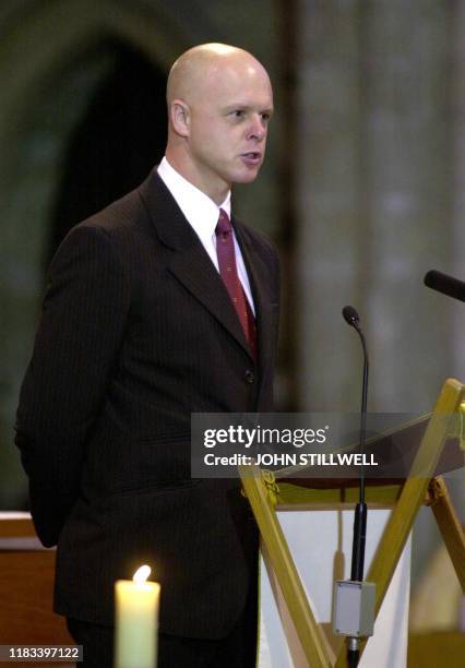 Kevin Wells reads a poem during a service 30 August 2002 at the Ely cathedral to remember the lives of his daughter Holly and her friend Jessica...