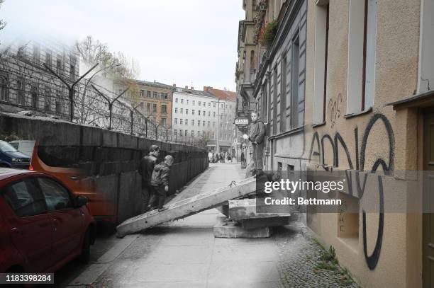 This digital composite image shows Sebastianstrasse in Berlin in 1963 and on October 21, 2019 . BERLIN, GERMANY Two women walk along...
