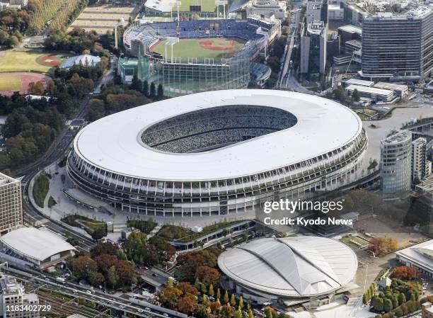 Photo taken in Tokyo from a Kyodo News helicopter on Nov. 19 shows the new National Stadium, the main venue for the 2020 Tokyo Olympics and...