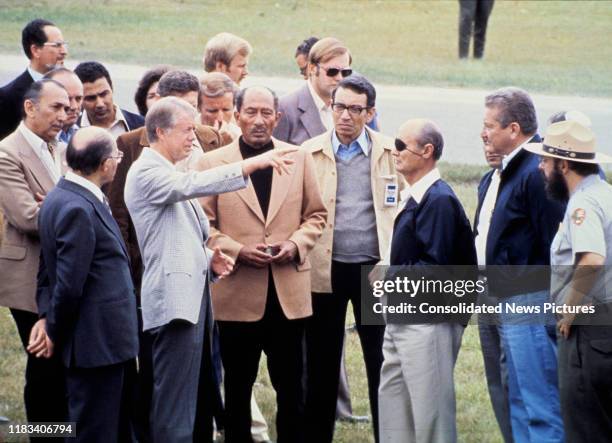 View of, fore from left, Israeli Prime Minister Menachem Begin , US President Jimmy Carter , Egyptian President Anwar Al Sadat , Egyptian Minister of...