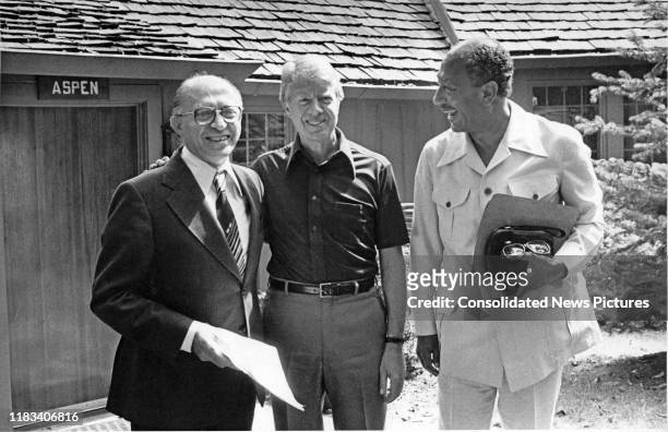 Portrait of from left, Israeli Prime Minister Menachem Begin , US President Jimmy Carter, and Egyptian President Anwar Al Sadat as they pose together...