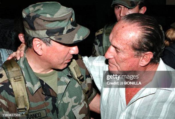 Colombian football federation vice-president Hernan Mejia Campuzano embraces the general Franco in Pereira, Colombia, 28 June 2001. Campuzano was...