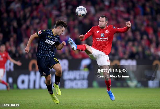 Noah Katterbach of 1.FC Koln is challenged by Levin Öztunali of 1.FSV Mainz 05 during the Bundesliga match between 1. FSV Mainz 05 and 1. FC Koeln at...