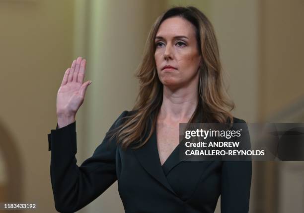 Jennifer Williams, an aide to Vice President Mike Pence takes the oath before she testifies before the House Intelligence Committee, on Capitol Hill...