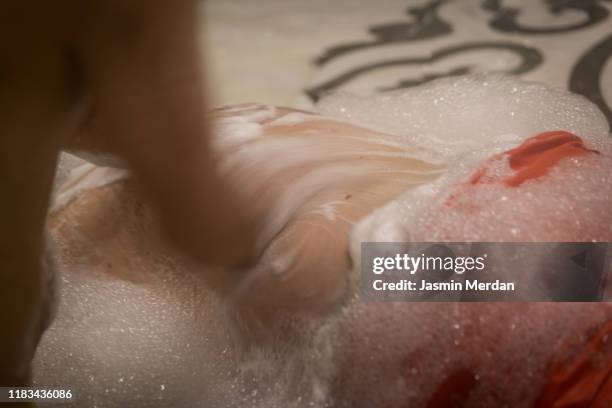 motion turkish hamam experience - men in loincloths stock pictures, royalty-free photos & images