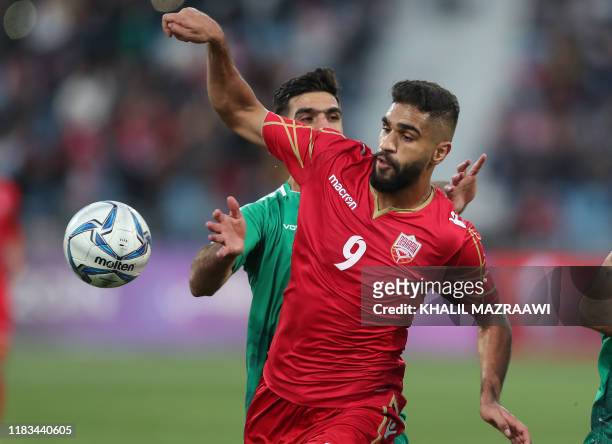 Bahrain's forward Abdulla Yusuf Helal controls the ball during the FIFA World Cup 2022 and the 2023 AFC Asian Cup qualifying football match between...