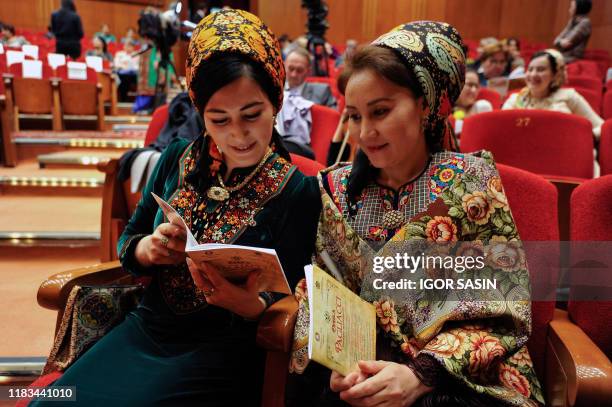 Two Turkmen women wait to watch the premiere of Pagliacci, an Italian opera by Ruggero Leoncavallo directed by Danielle De Plano, at the Makhtumkuli...