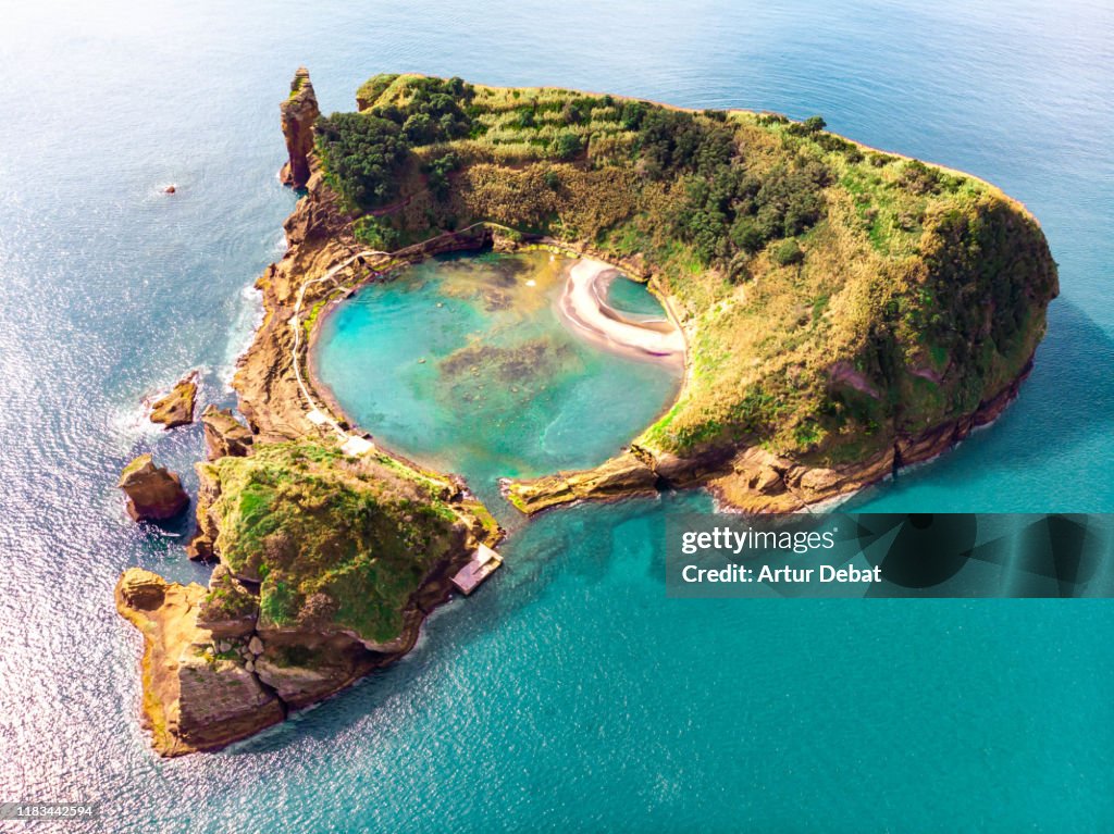 Cool aerial view of circle pool inside volcanic island with eye shape in the Azores islands.