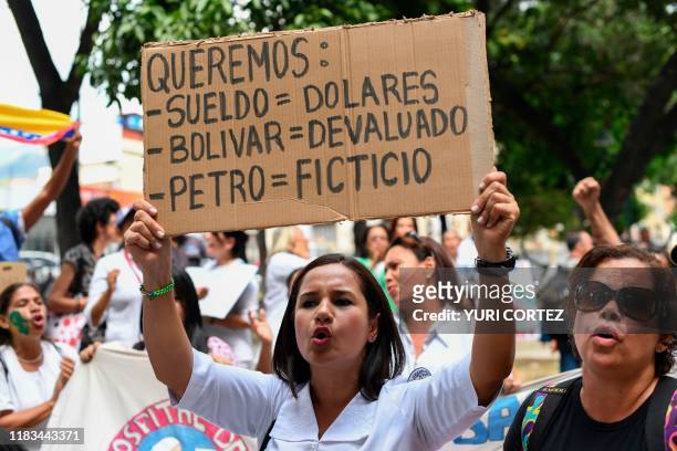 Nurse shouts slogans in front of the Jose Manuel de los Rios Children's Hospital during a protest called by Venezuelan opposition leader and...