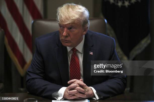 President Donald Trump listens during a Cabinet Meeting at the White House in Washington, D.C., U.S., on Tuesday, Nov. 19, 2019. Trump accused House...