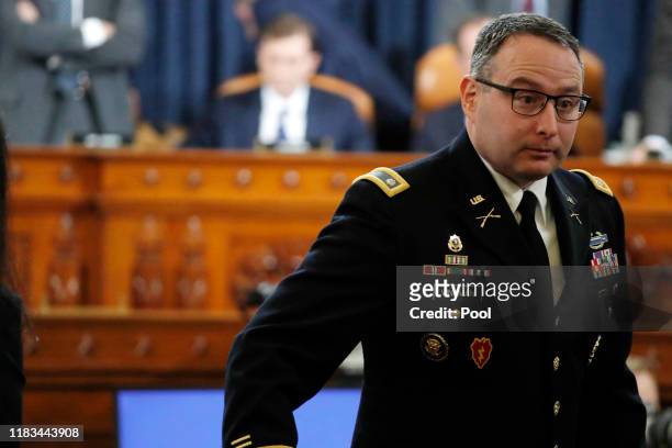 Lt. Col. Alexander Vindman, National Security Council Director for European Affairs takes a break as he testifies during a hearing before the House...