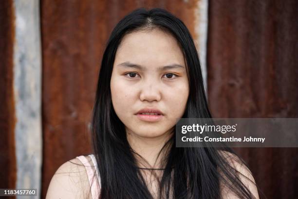 sad young woman looking at camera - worried face stock pictures, royalty-free photos & images