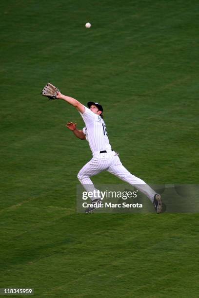 Outfielder Bryan Petersen of the Florida Marlins misses a catch against the Philadelphia Phillies at Sun Life Stadium on July 6, 2011 in Miami...