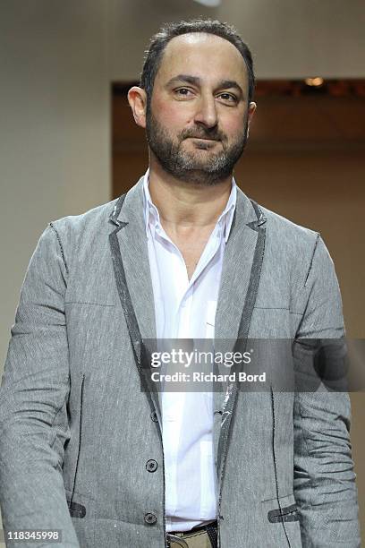 Designer Dany Hatrache walks the runway during the Dany Atrache Haute Couture Fall/Winter 2011/2012 show as part of Paris Fashion Week Hotel Ritz on...