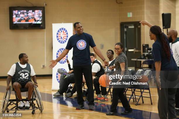 Legend Buck Williams and WNBA Legend Taj McWilliams-Franklin during an NBA Cares wheelchair basketball game at Walter Reed Medical Center on November...