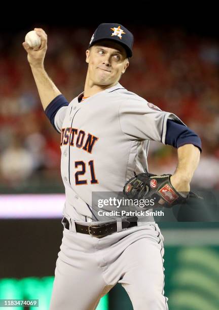 Zack Greinke of the Houston Astros delivers the pitch against the Washington Nationals during the first inning in Game Three of the 2019 World Series...