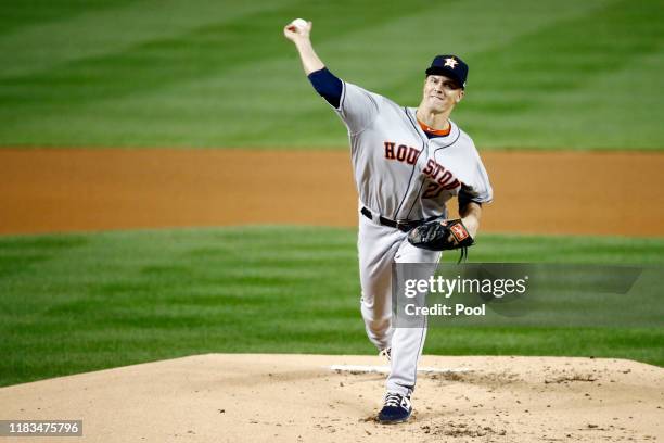 Zack Greinke of the Houston Astros delivers the pitch against the Washington Nationals during the first inning in Game Three of the 2019 World Series...