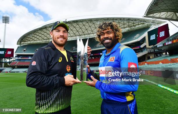 Aaron Finch captain of Australia holds the Twenty Twenty Trophy with Lasith Malinga captain of Sri Lanka during a Cricket Australia media opportunity...