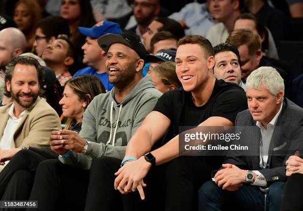 Sabathia and Aaron Judge of the New York Yankees watch the Brooklyn Nets and New York Knicks game at Barclays Center on October 25, 2019 in the...