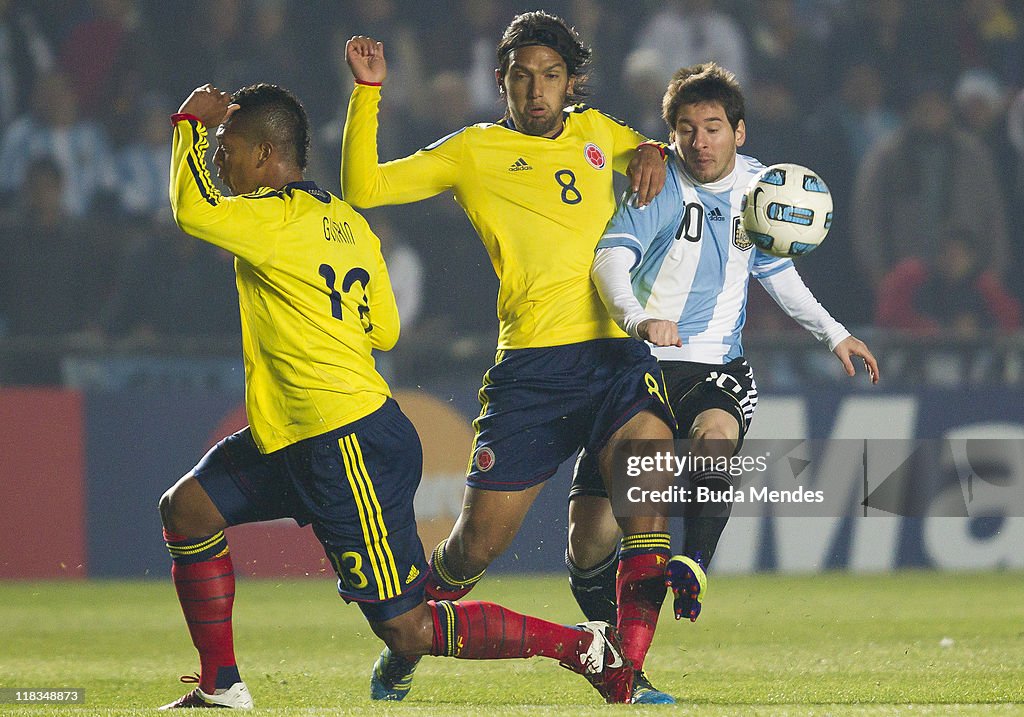 America 2011 Lionel Messi of Argentina struggles for the ball with Fredy Guarin ...